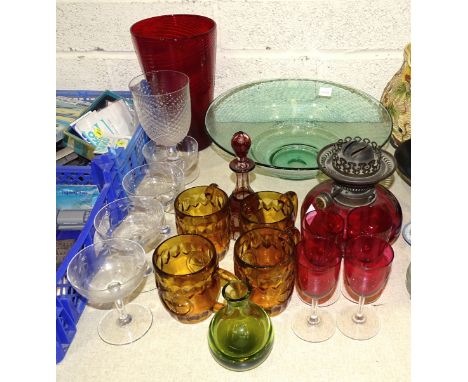 A large studio bubble glass bowl, 34cm diameter, 11cm high, a cranberry glass oil lamp reservoir with burner, four amber glas