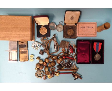 An Imperial Service Medal to David James Crowther, cased, various Duke of Cornwall's Light Infantry cap badges, buttons, etc,