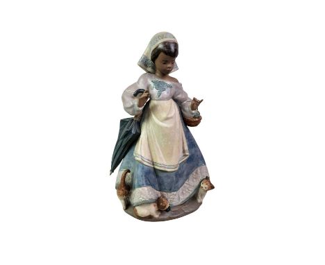 COLLECTION OF LLADRO AND OTHER CERAMIC FIGURES, AND TWO NAO CATS including two Geisha, Boy with Dog, and Underfoot, a girl fi