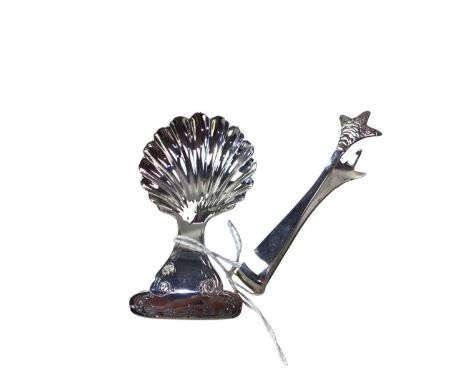 SILVER CADDY SPOON, SHEFFIELD MARKS with a shell formed bowl, along with a pair of small silver sugar tongsQty: 2