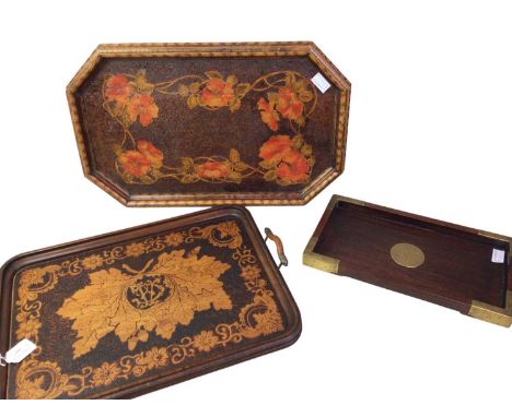 THREE SERVING TRAYS, comprising a twin-handled poker work tray, a further poker work style example and a Chinese brass bound 
