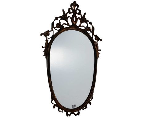 FRENCH STYLE WALL MIRROR, LATE 20TH CENTURY of oval form, with floral pediment101cm long