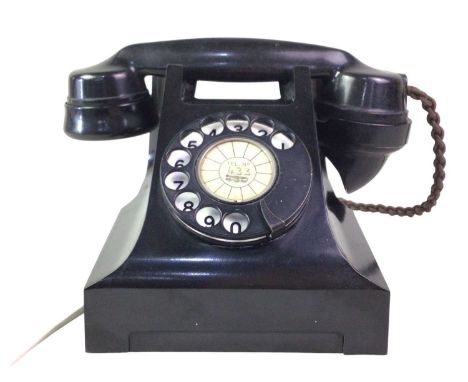 VINTAGE BLACK BAKELITE TELEPHONE, 1950s-90s on raised circular feet13.5cm high 