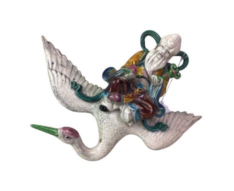 CHINESE ROOF TILE, modelled with Shouxing riding a swan, unmarked30cm wide from tips of each wing
