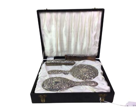 SILVER VANITY SET, B & CO, BIRMINGHAM MARKS embossed with scrolls and foliage in the Victorian style comprising two brushes, 