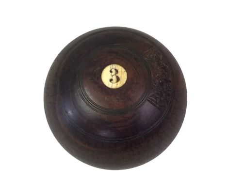 SET OF FOUR LAWN BOWLS, in leather case, with simulated ivory and bone inlay.
