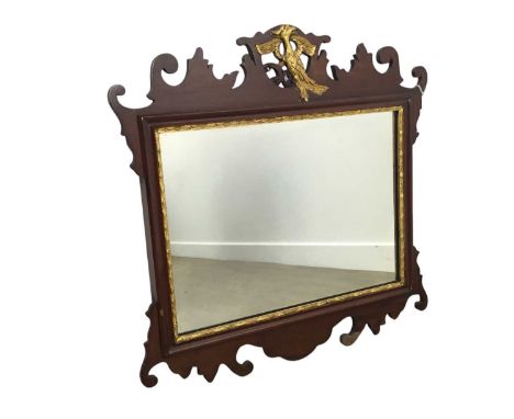 CHIPPENDALE STYLE MAHOGANY AND PARCEL GILT WALL MIRROR, EARLY 20TH CENTURY  the pierced pediment with a gilded phoenix over t