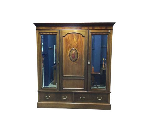 EDWARDIAN MAHOGANY AND SATINWOOD WARDROBE, fitted with three doors over two drawers214cm x 195cm