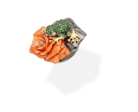 CORAL AND GEM-SET DRESS RINGThe circular-cut tsavorite garnet frog, accented by brilliant-cut diamond eyes and feet, perched 