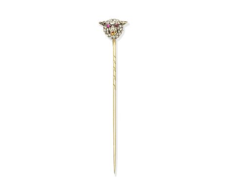 ENAMEL AND GEM-SET FOX MASK STICK PIN, CIRCA 1900The snarling fox with old brilliant and rose-cut diamond head, cabochon ruby