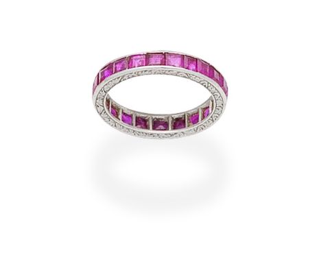 RUBY ETERNITY RINGSet throughout with step-cut rubies,  ring size approx. IFor further information on this lot please visit B