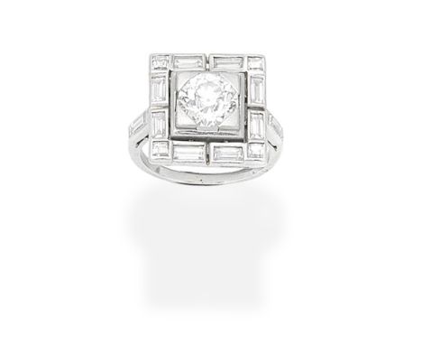 DIAMOND PLAQUE RINGThe square-shaped plaque set with a cushion-shaped diamond within a baguette and square-cut diamond surrou