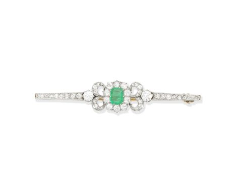 EMERALD AND DIAMOND BAR BROOCHThe octagonal step-cut emerald within an old brilliant-cut diamond surround, between scrolled s