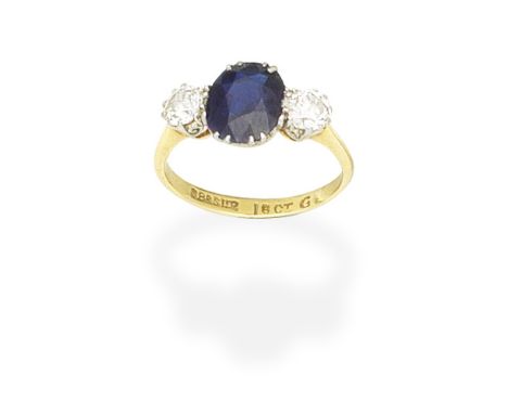 SAPPHIRE AND DIAMOND RINGThe oval-cut sapphire between old brilliant-cut diamonds, ring size approx. KFor further information