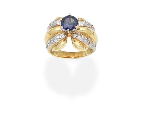 SAPPHIRE AND DIAMOND-SET DRESS RINGThe circular-cut sapphire, between bi-coloured reeded shoulders set with brilliant-cut dia