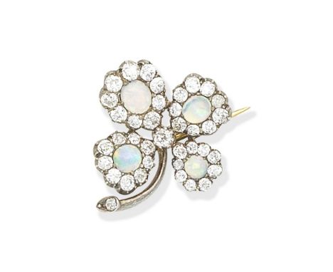 OPAL AND DIAMOND FOUR LEAF CLOVER BROOCH, EARLY 20TH CENTIURYSet with cabochon opal and old brilliant-cut diamond leaves, the