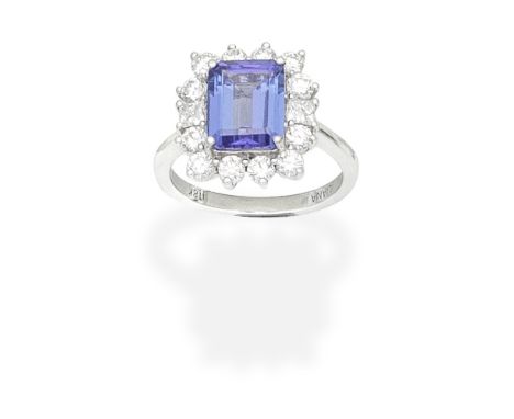 ILIANA: TANZANITE AND DIAMOND CLUSTER RINGThe step-cut tanzanite within a border of brilliant and princess-cut diamonds, diam