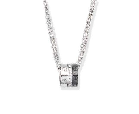 CARTIER: CERAMIC AND DIAMOND-SET NECKLACEThe fancy-linking chain suspending three rings with screwhead motifs, one set with b