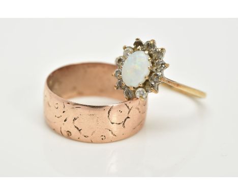 A 9CT GOLD OPAL CLUSTER RING AND A WIDE BAND, the cluster designed with a central oval cabochon opal within a circular cut pa