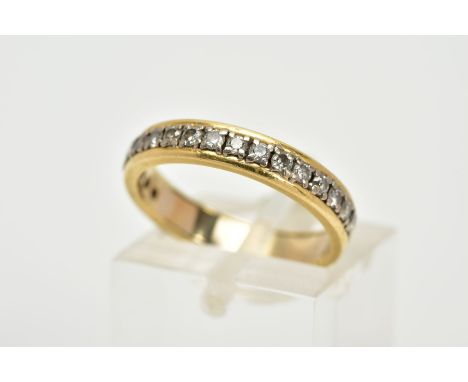 A YELLOW METAL DIAMOND HALF ETERNITY RING, designed with a row of claw set,  round brilliant cut diamonds, total estimated di