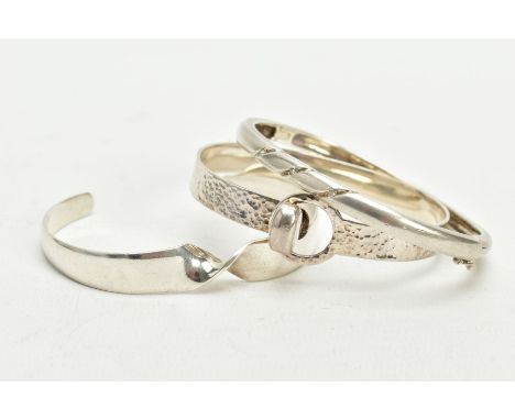 THREE SILVER BANGLES, the first a twist cuff hallmarked London, together with a silver hinged bangle set with three single cu