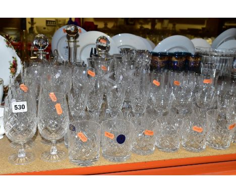 A QUANTITY OF GLASSWARE, mostly drinking glasses, decanters, cracker barrels and covers, a ship in a bottle, Edinburgh Crysta