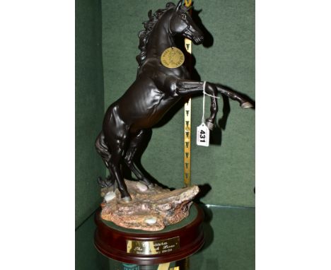 A BESWICK 'CANCARA - THE BLACK HORSE', modelled by Graham Tongue, with 'Beswick Centenary 1894 - 1994' backstamp, on a sepera