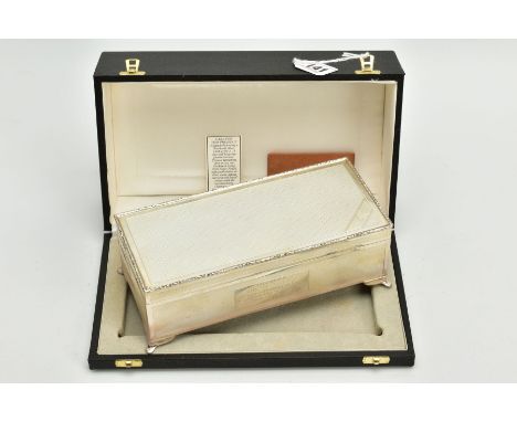 A LATE ,20TH CENTURY SILVER RECTANGULAR DESK CASE, hinged lid, wooden interior, measuring approximately 200mm x 90mm x 700mm,