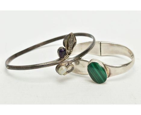 A SILVER MALACHITE SET BANGLE AND A WHITE METAL ARM CUFF, the hinged bangle set with an oval malachite cabochon, hallmarked L