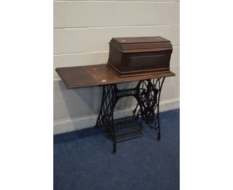 A VINTAGE SINGLE TREADLE SEWING MACHINE