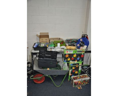 A QUANTITY OF GARDENING TOOLS AND OUTDOOR EQUIPMENT including outdoor lights, pond pumps, a wheelbarrow, two power extension 