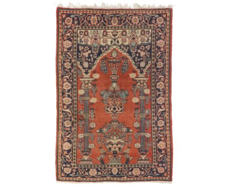 * Carpet. A Middle Eastern woollen prayer rug, early-mid 20th century, patterned rug with vase of flowers flanked by 2 pedest