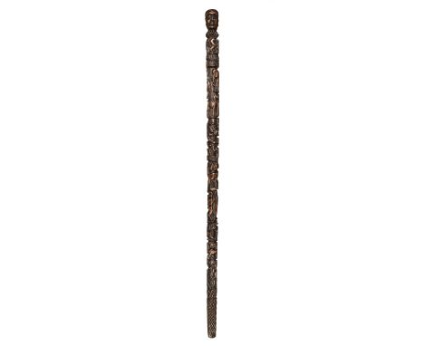 * Walking Stick. George III period folk art walking stick, the oak stick with a figural knop and profusely carved with symbol