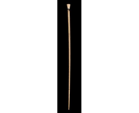 * Whalebone Stick. Early 19th century whalebone stick, spiral carved with chequered section, the octagonal marine ivory top w