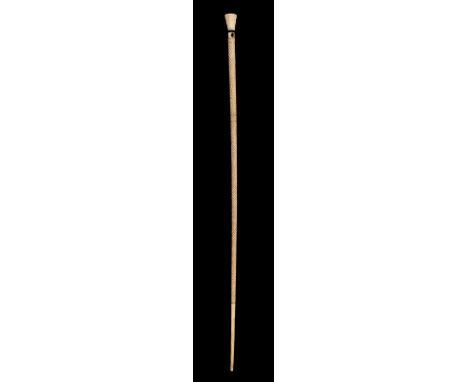 * Whalebone Stick. Early 19th century whalebone stick, spiral carved with chequered section, the octagonal marine ivory top w