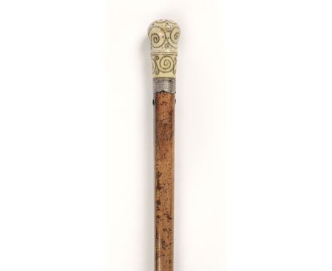 * Walking Stick. George I pique cane, the ivory top finely inlaid with pique work with silver collar engraved 'Thomas Lowe de