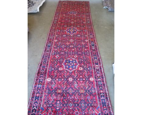 A hand knotted Hamadan woollen runner - 4.05m x 1.10m 
