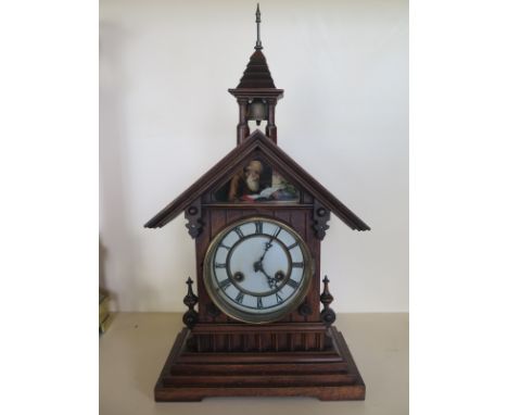 An 8 day mantle clock, oak case, strikes hours and half on the gong - 52cm tall - some old repairs, running in sale room 