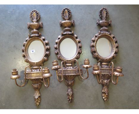 Three gilt mirror back twin branch candelabra - 78cm H 