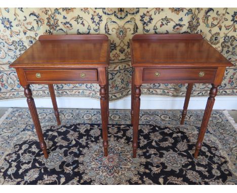 A pair of rosewood cross banded lamp tables each with a single drawer on turned reeded legs, made by local craftsman standard
