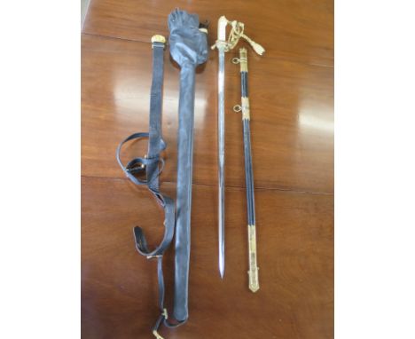 An Elizabeth II Naval Officers dress sword with scabbard belt and cover - Gieves, in very good condition, some creasing to co