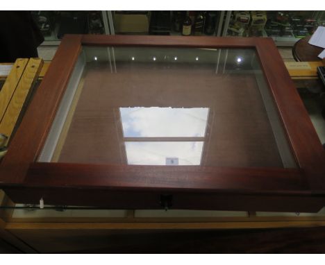 A contemporary table top, jewellery display cabinet, with electric side lighting, mahogany veneer frame, approximately 78cm w