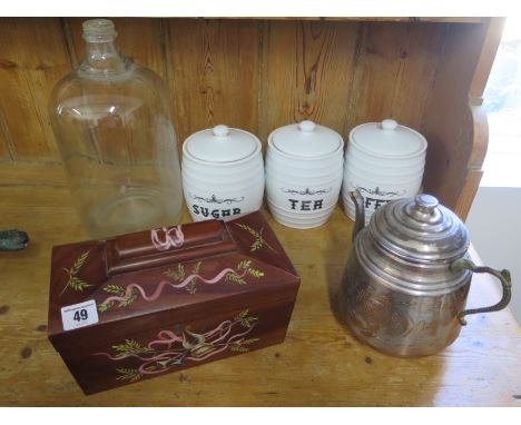 Three ceramic containers, a tea pot, glass bottle and a decorated tea caddy 