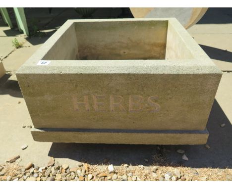A weathered limestone planter with Herbs carved on one side - 31cm H x 53cm square 