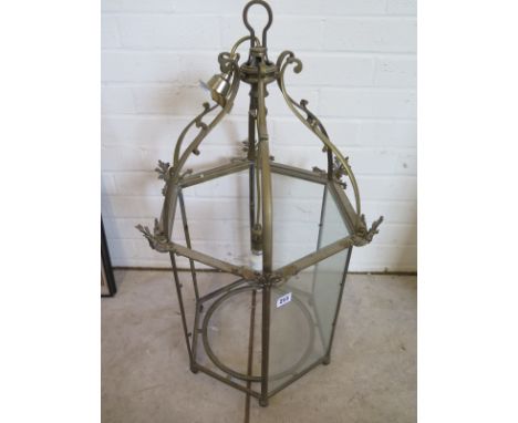 A brass hexagonal hall lantern 80cm H - 43cm W - three glass panes missing 