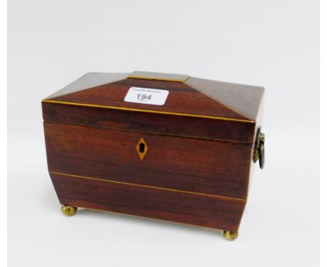 19th century mahogany and inlaid sarcophagus shaped tea caddy on four brass bun feet with ring handles to side, 20 x 14cm 