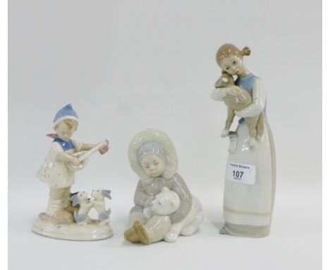 Two Lladro figures to include a 'Child with Polar Bear' and a 'Girl with Lamb' and a similar German figure of a 'Girl playing