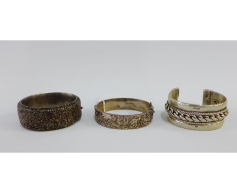 Vintage floral embossed silver bangle by Lilley &amp; Co, Birmingham 1967 together with another similar stamped Sterling and 
