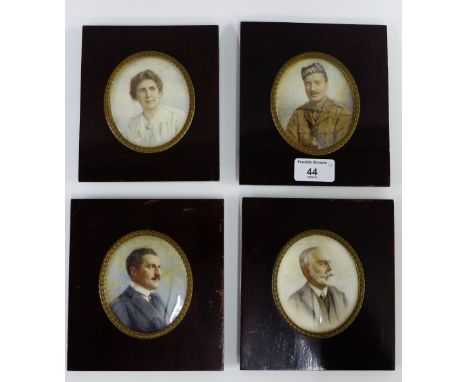 A family group of four early 20th century portrait miniatures, each contained within glazed mahogany frames (4) 