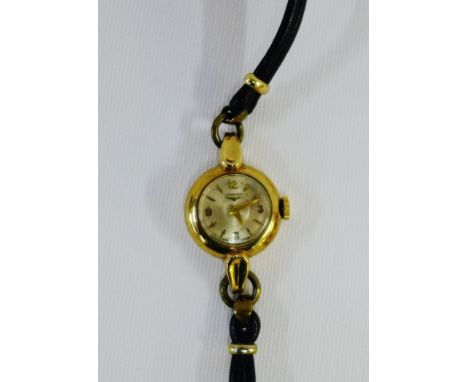 Vintage 9 carat gold cased Lady's Longines wristwatch on a black leather strap 